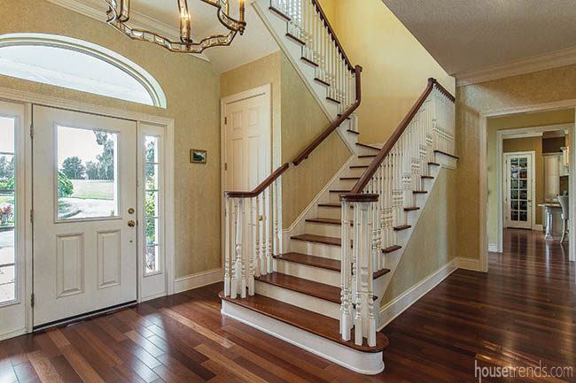 Front entry leads to a curved staircase