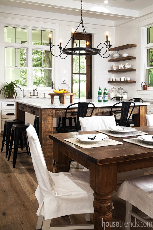 Farm table offers additional seating in a kitchen