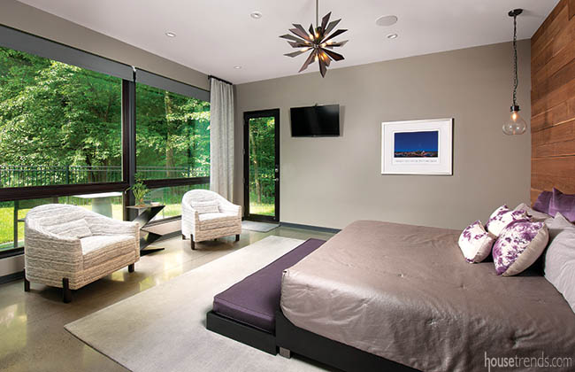 Windows add natural light to a master bedroom