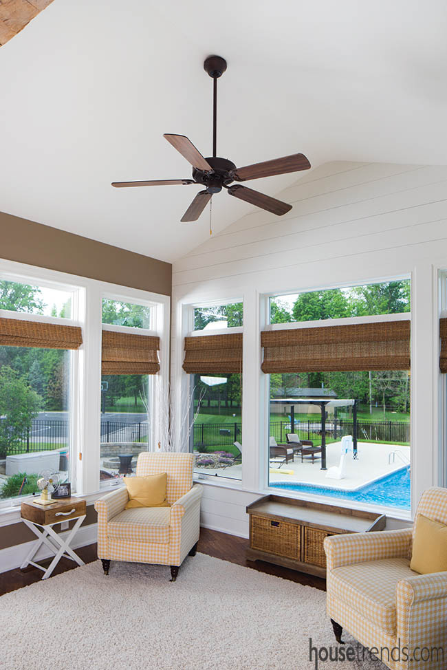 Sunroom windows offer view of a back yard