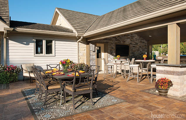 Area rug softens an outdoor dining area