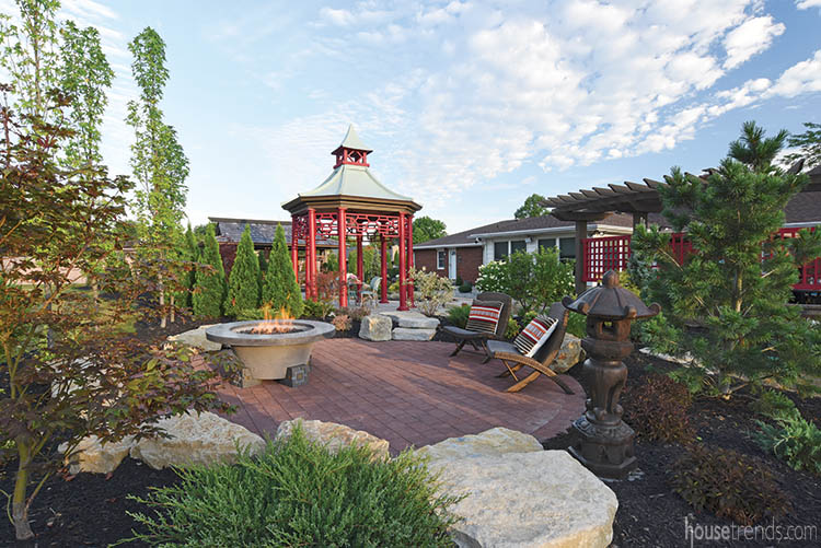 Paver patio hosts a fire pit