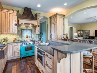 Kitchen island houses microwave drawer