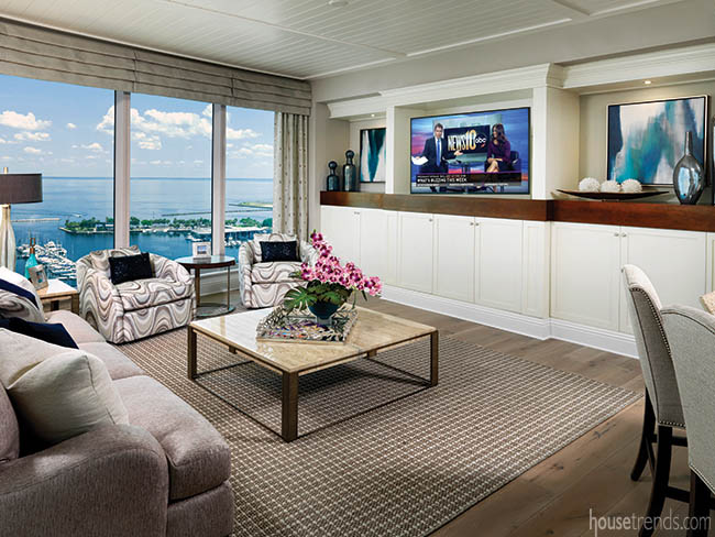 Built-in cabinetry hides a living room television