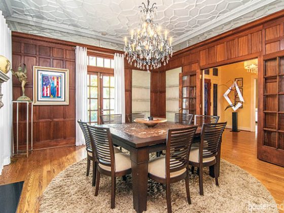 Dining room features mahogany paneled walls