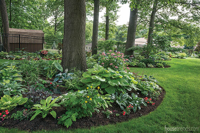 Flower beds surround trees