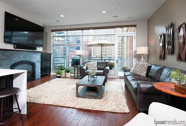 Television hangs over a fireplace