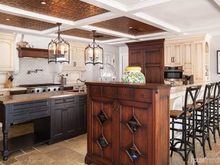 Armoire adds an elegant touch to a kitchen island