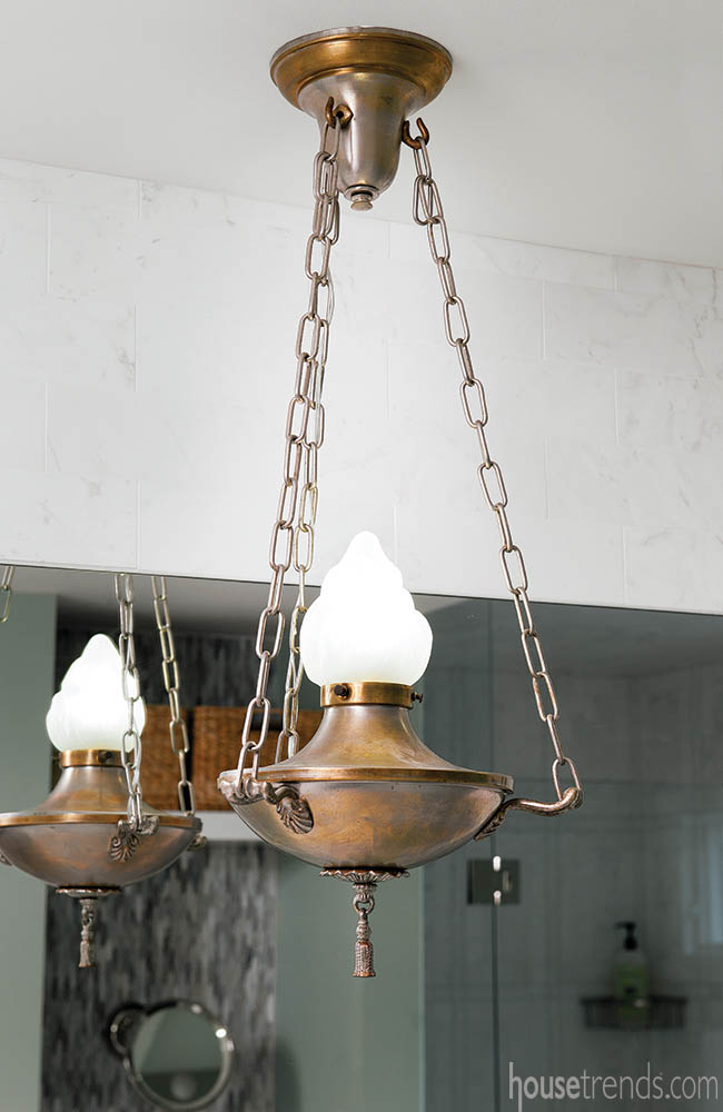 Copper light fixture adds drama to a master bath