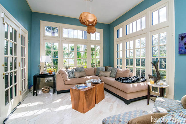 Blue walls brighten up a sunroom