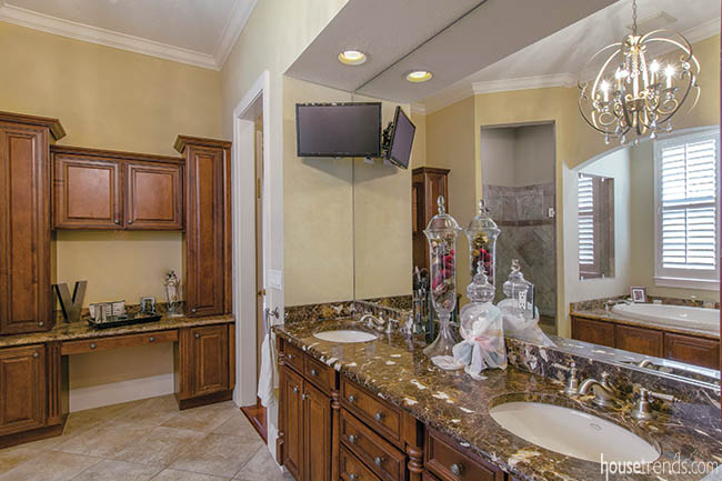 Bathroom mirror reflects back a corner shower