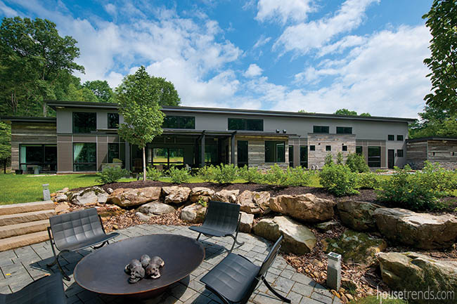 Back yard landscape boasts a fire pit