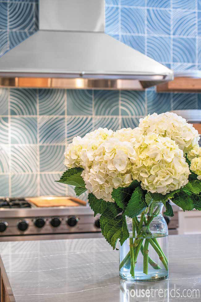 Vase of flowers perched on a quartz countertop