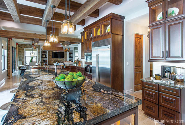 Granite countertops flatter copper fixtures in a kitchen