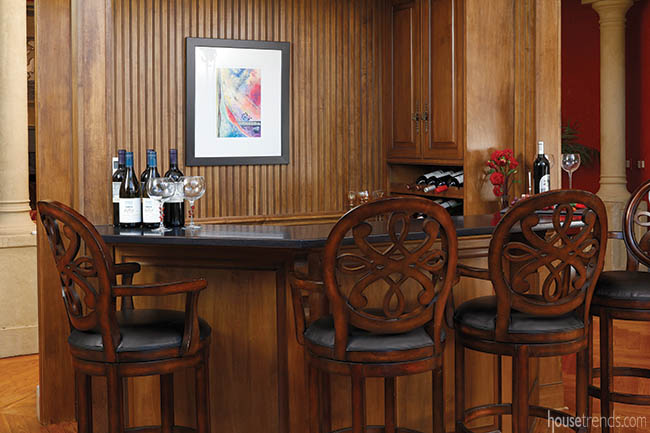 Wall art adds personality to a home bar
