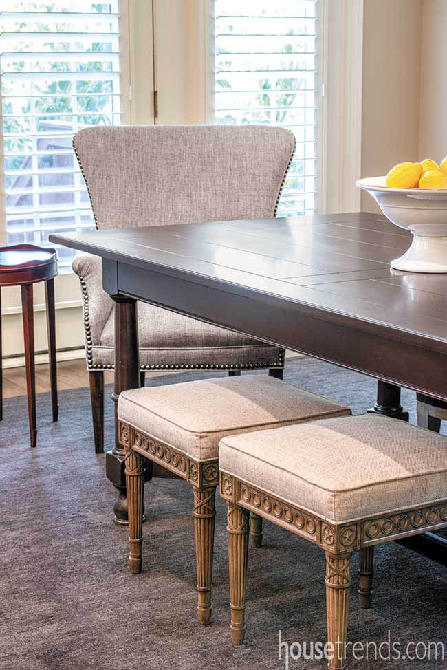 Refinished table surrounded by unique seating options