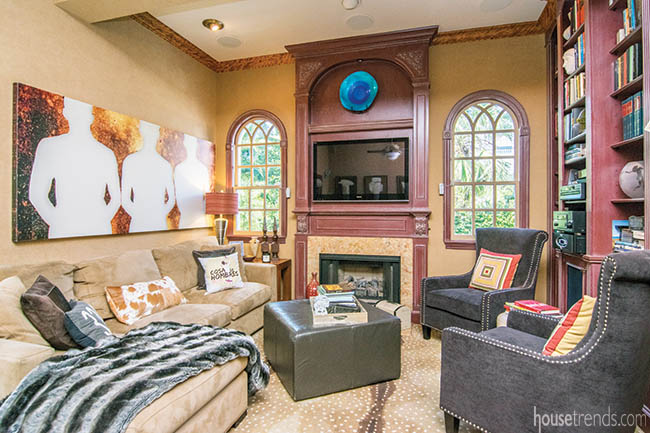 Arched windows lend natural light to a man cave