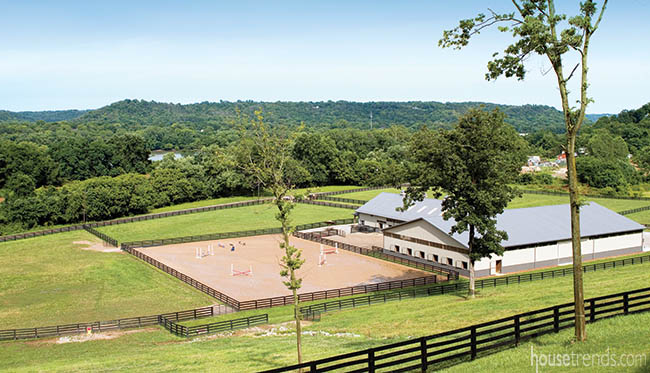 Large stable nestled into a landscape