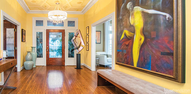 Yellow walls create a cheery entry hall
