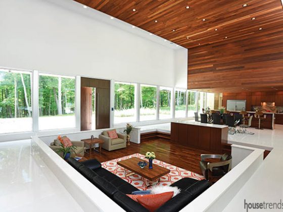 Front doors nestled between wall of windows