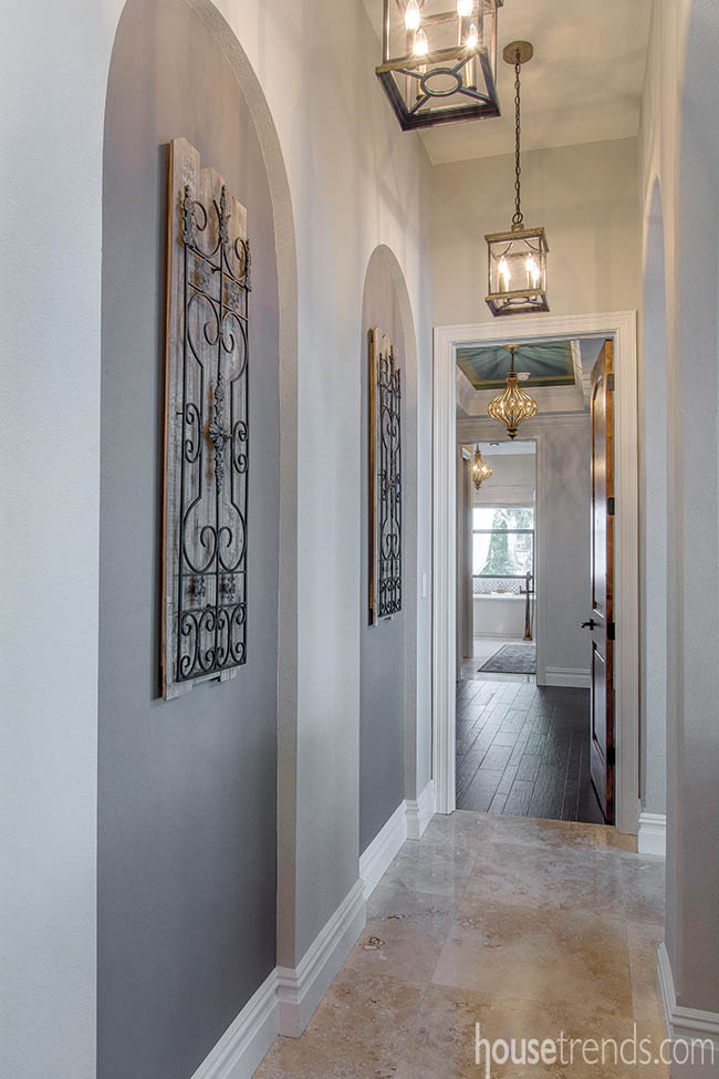 Wall niches add interest to a hallway design