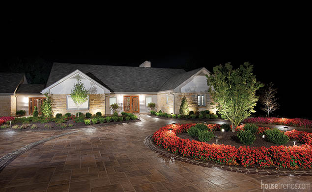 Landscape lighting highlights a circle drive