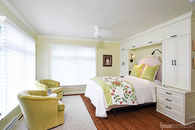 Automatic shades lighten a master bedroom