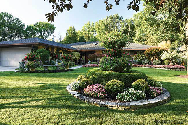 Stone base encircles a plethora of plants