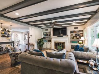 Ceiling beams add cozy vibe to a family room