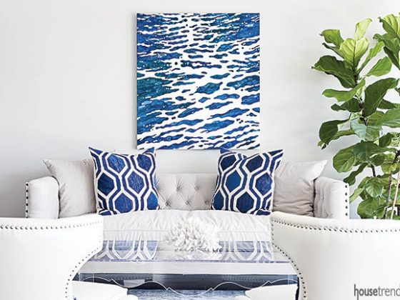 Navy accents pop in a white living room