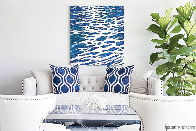 Navy accents pop in a white living room