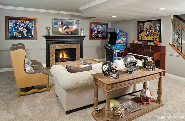 Football memorabilia dresses up a lower level living room