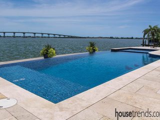 Swimming pool looks like it slips into the waterway