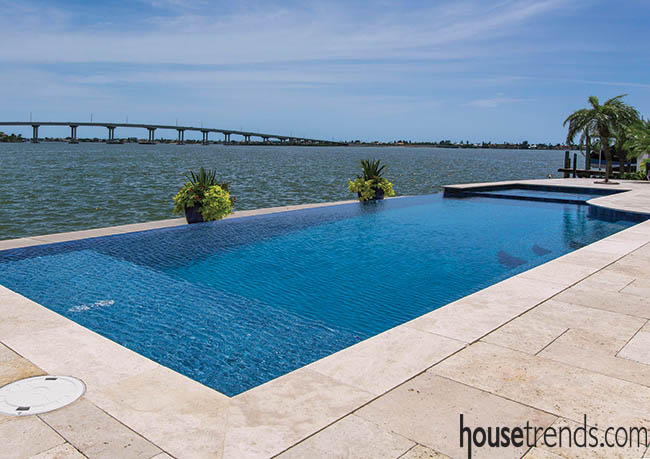 Swimming pool looks like it slips into the waterway