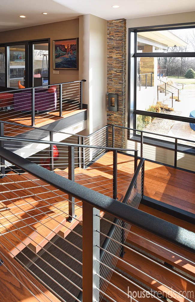 Metal staircase railings seen indoors and out