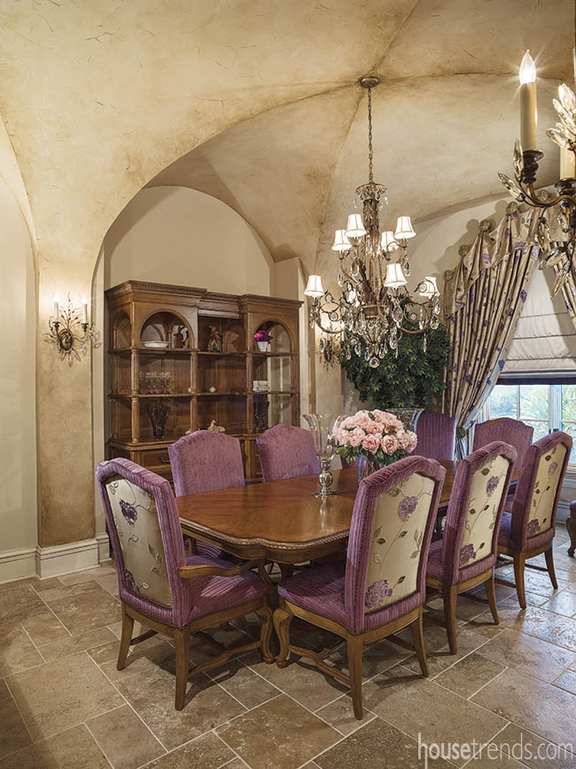 Formal dining room awash in golds and purples