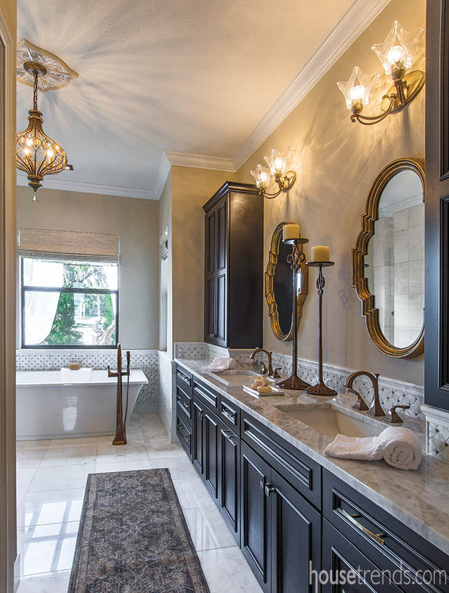 Lighting and mirrors add feminine touch to a master bath