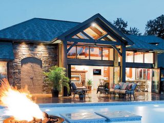 Outdoor lighting adds sparkle to a pool house