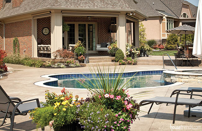 Retractable screens protect an outdoor living space