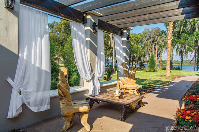 White curtains soften a pergola design