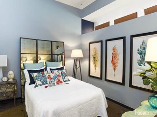 Mirror reflects back a bedroom