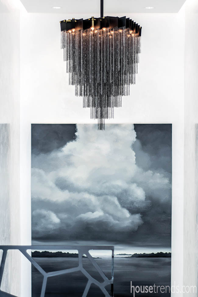 Black chandelier adds drama to a third-floor landing