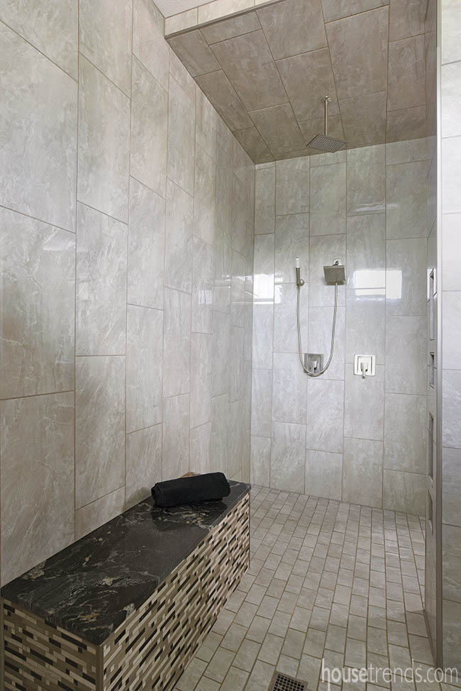 Dark shower bench adds a nice contrast