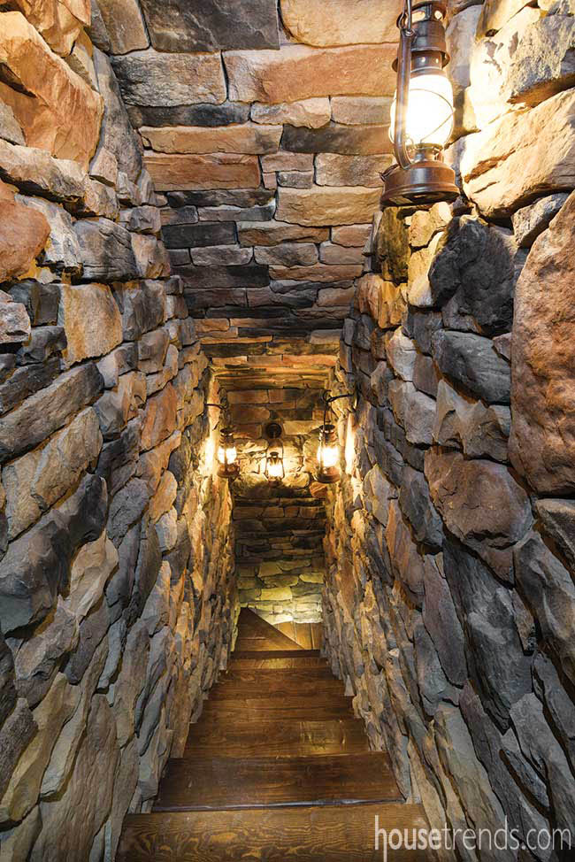 Lanterns illuminate a stone-lined passageway