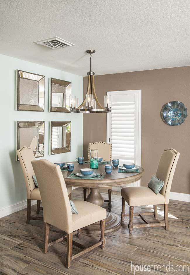 Dishes add color to a neutral breakfast nook