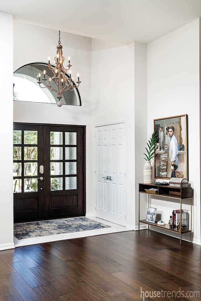 Transom window adds natural light to a foyer