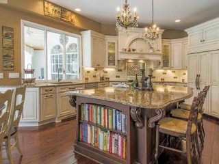 Kitchen island provides counter space and shelving