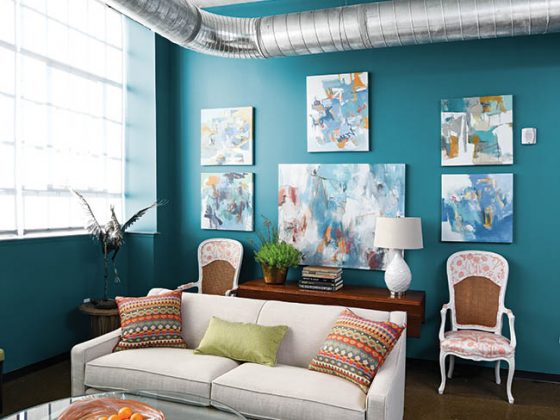 Living room with a cluster of paintings