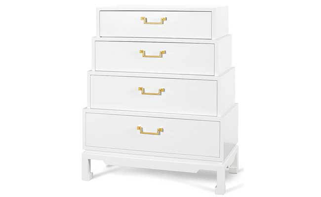 Brass hardware pops on a white dresser
