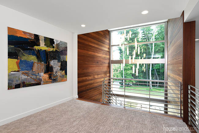 Painting adds interest to a second floor hallway